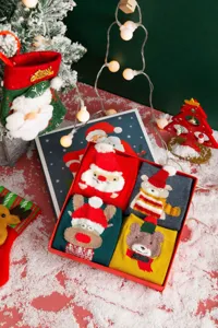 Christmas gift box set with four pairs of adorable cartoon 3D holiday crew socks.