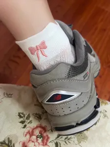 Chic women's short socks featuring a cute pink embroidered bowknot, breathable mesh daily wear.