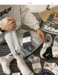 Detailed view of casual cotton crew socks with letter print and neat packaging display.
