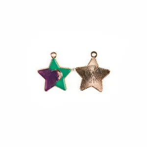 Detail view of two-tone enameled star metal pendant, DIY jewelry making charm accessory.