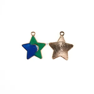 Close-up detail of the starry alloy pendant charm, showing front enamel texture and back.