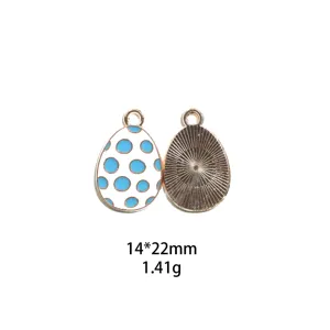 Paasei legering emaille hanger detail met blauwe stippen en zonnestraal achterkant.