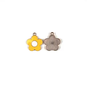 Close-up detail shot of colorful enamel daisy flower alloy DIY jewelry charm pendant.