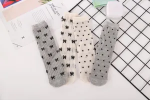 Summer thin mesh hollow mid-calf socks with cute bows and polka dots for stylish daily wear.