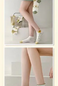 Women summer sheer short socks with sweet tulip embroidery and delicate ruffled cuffs.