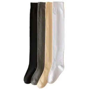 Detailed view of women's long over-the-knee socks in four classic colors for autumn and winter.