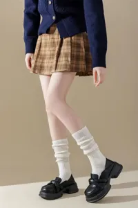 Detail shot of casual women's solid color slouchy calf socks featuring comfortable ribbed knit style.