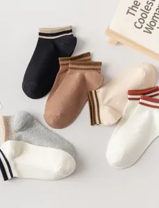 Detailed close-up view of women casual short socks with striped cuffs in various classic colors.
