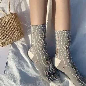 Casual grey mid-calf socks with white wave patterns and cute floral embroidery for daily wear.