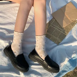Japanese style women lace floral mid-tube socks paired with black loafers, sweet versatile fashion.