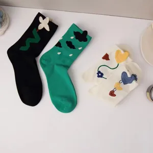 Cute 3D floral heart crew socks for women, trendy sweet casual long socks for daily wear.