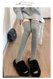Comfortable gray over-the-knee knit socks for women, stylish ribbed long winter leg warmers.