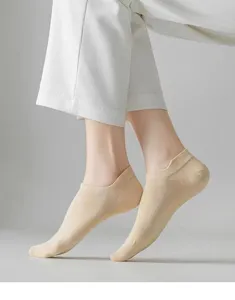 Detail view of thin breathable beige low-cut women boat socks showing fabric texture.
