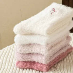 Fluffy winter plush socks detail, cozy mink fleece gradient pink and white cozy home socks.