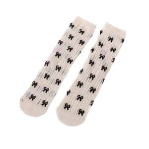 Women white sheer mesh mid-calf socks with cute black bow prints, sweet Japanese daily socks.