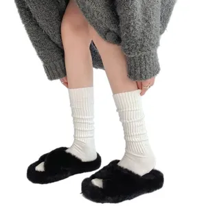 White ribbed slouch socks detail shot showing cozy texture and soft fabric fit perfectly.