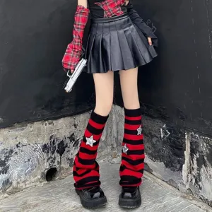 Detail shot of red and black striped knit leg warmers with star details for Y2K outfits.