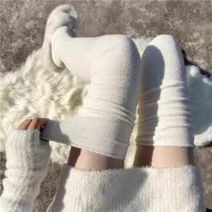 Detailed view of women's plush over-the-knee fuzzy socks, thick winter thermal leg warmers.