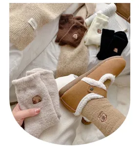 Detailed view of cute capybara embroidered fuzzy winter socks, cozy home floor socks in soft plush.