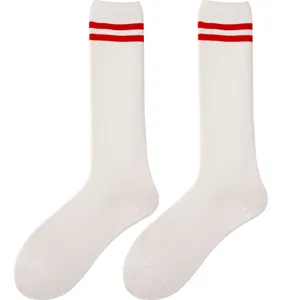 Classic white athletic tube socks featuring bold red stripes for a retro vintage college look.
