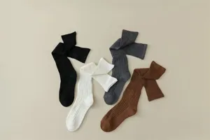 Women's solid color ribbed long knee-high socks, casual spring autumn daily wear detail view.