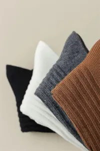 Close-up detail of women's multi-color ribbed knit casual long socks texture fabric.