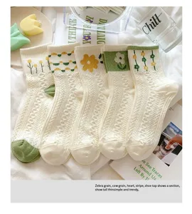 Japanese style sweet floral mid-calf socks for women, cute green and yellow embroidery design.