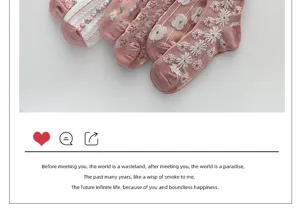 Close-up detail showcasing the delicate floral embroidery and soft knit texture of pink socks.