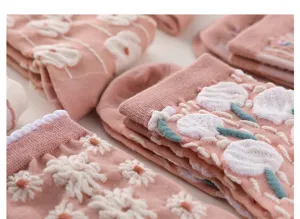 Pink floral embroidered mid-tube socks detail view, showing cute tulip and daisy 3D texture.