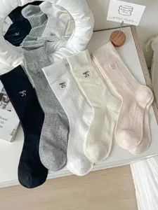 Ballet style solid color ribbed knit long socks with cute bow embroidery, versatile daily wear.