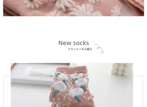Pink mid-calf socks featuring cute 3D embroidered floral patterns and cozy texture.