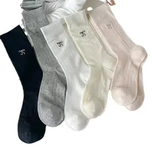 Women's casual cotton rib knit mid-calf socks with cute bow embroidery for daily wear