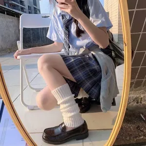 Japanese style white knit leg warmers for women, cozy casual hosiery accessory for daily wear.