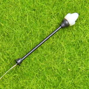 Closeup of miniature LED street lamp model for DIY moss landscape and succulent gardening decor.