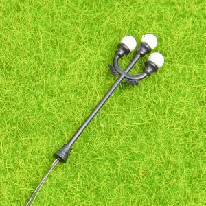 Miniature triple head street lamp model for DIY moss micro landscape and garden decoration.