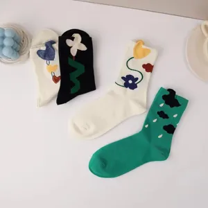 Cute women mid-calf socks with 3D floral and heart designs, soft cotton casual hosiery.