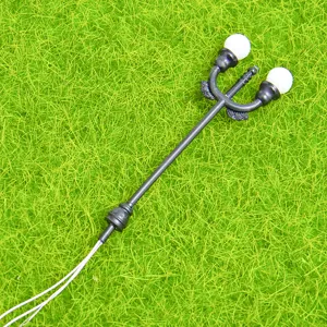 Miniature double head street lamp detail view, perfect for DIY moss landscaping and dollhouse decor.