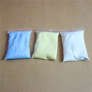 Colored fine sand details for micro landscape DIY, blue, yellow and white sand bags closeup.