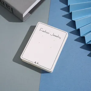Detailed view of white earring display cards, perfect for jewelry packaging and retail display.