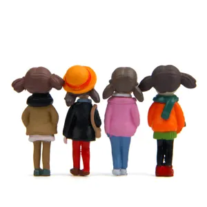 Detail view of cute winter girl resin figurines, perfect for moss micro landscape decor.