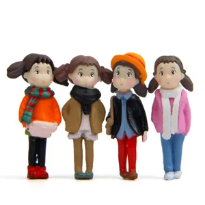 Miniature winter scarf girl figurines for moss micro landscape desktop decoration and DIY craft.