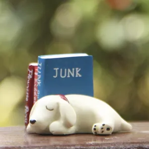Cute miniature sleeping puppy resin figurine with mini books detail, perfect for micro landscape.