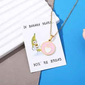 Funny banana cartoon pendant necklace with cute pink heart charm and humorous display card.