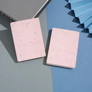 Detailed view of pink foil star jewelry display cards, perfect for earrings and necklaces.