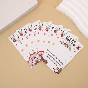 Christmas blessing cards detail shot, cute Santa and snowman design, perfect for gift packing.