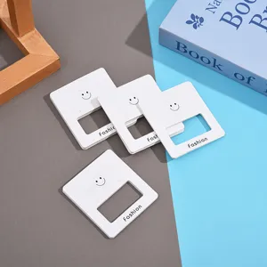 White square earring cards with cute smiley face design, perfect for jewelry display and retail packaging.