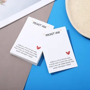 Detailed view of white Pocket Hug greeting cards with heart design, ideal for jewelry packaging.