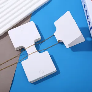 White folding necklace display cards detail shot, blank paper cards for jewelry packaging.