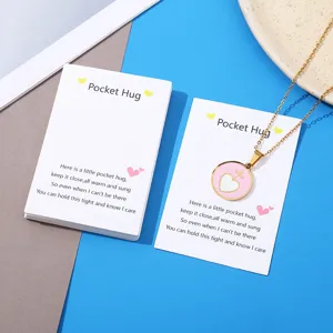 Stainless steel gold necklace with pink heart pendant and pocket hug greeting card set.