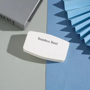 Multi-hole paper jewelry card for earrings and studs, elegant display packaging for accessories.